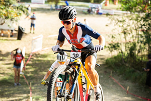 Kelsey Urban climbing while on course.